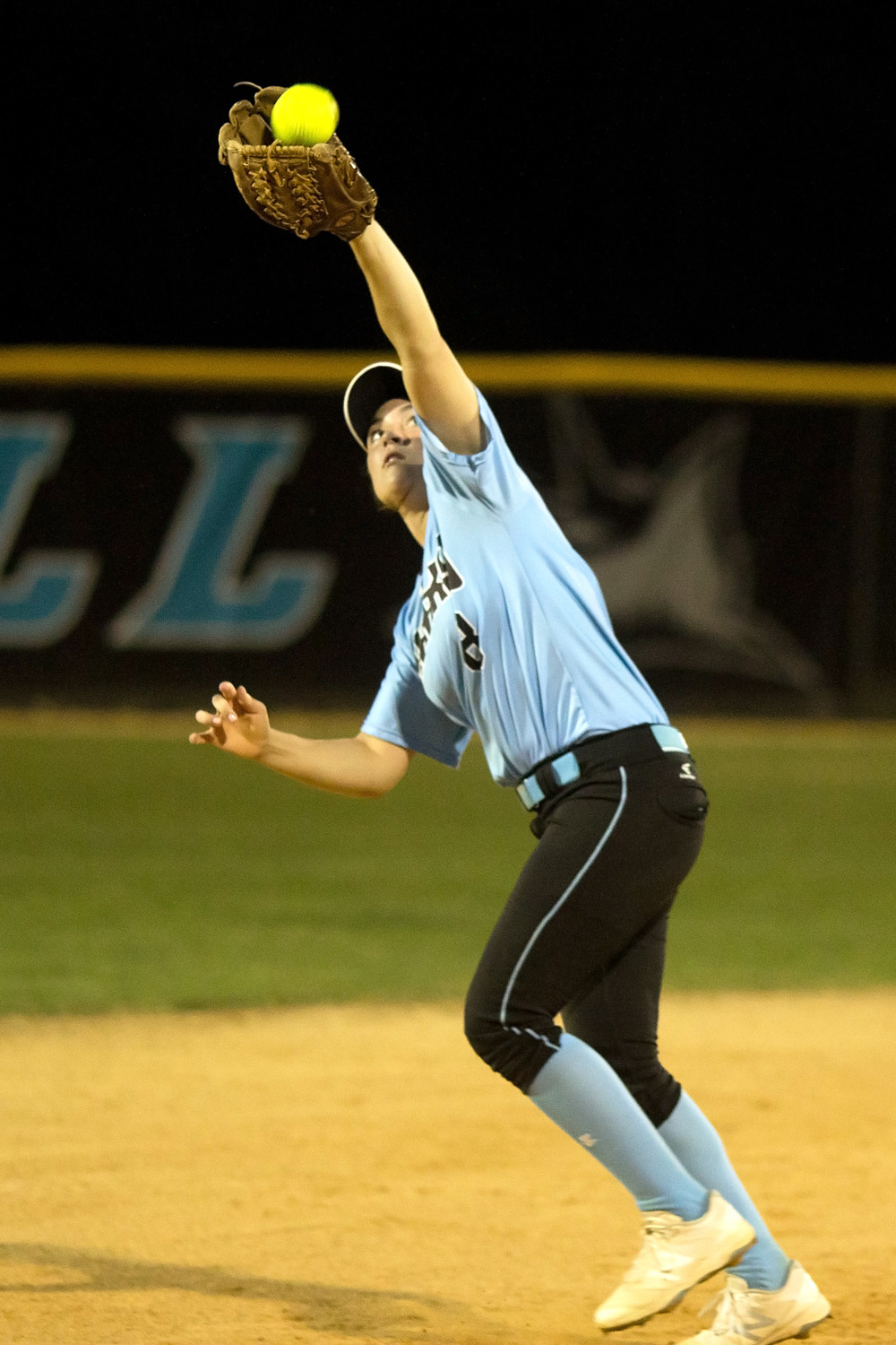 Shark shortstop Michelle Leone catches up to a short fly ball.